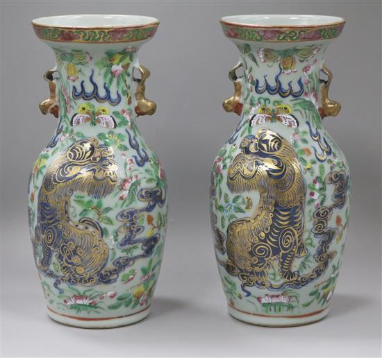 A pair of 19th century Chinese underglaze blue, famille rose celadon ground vases